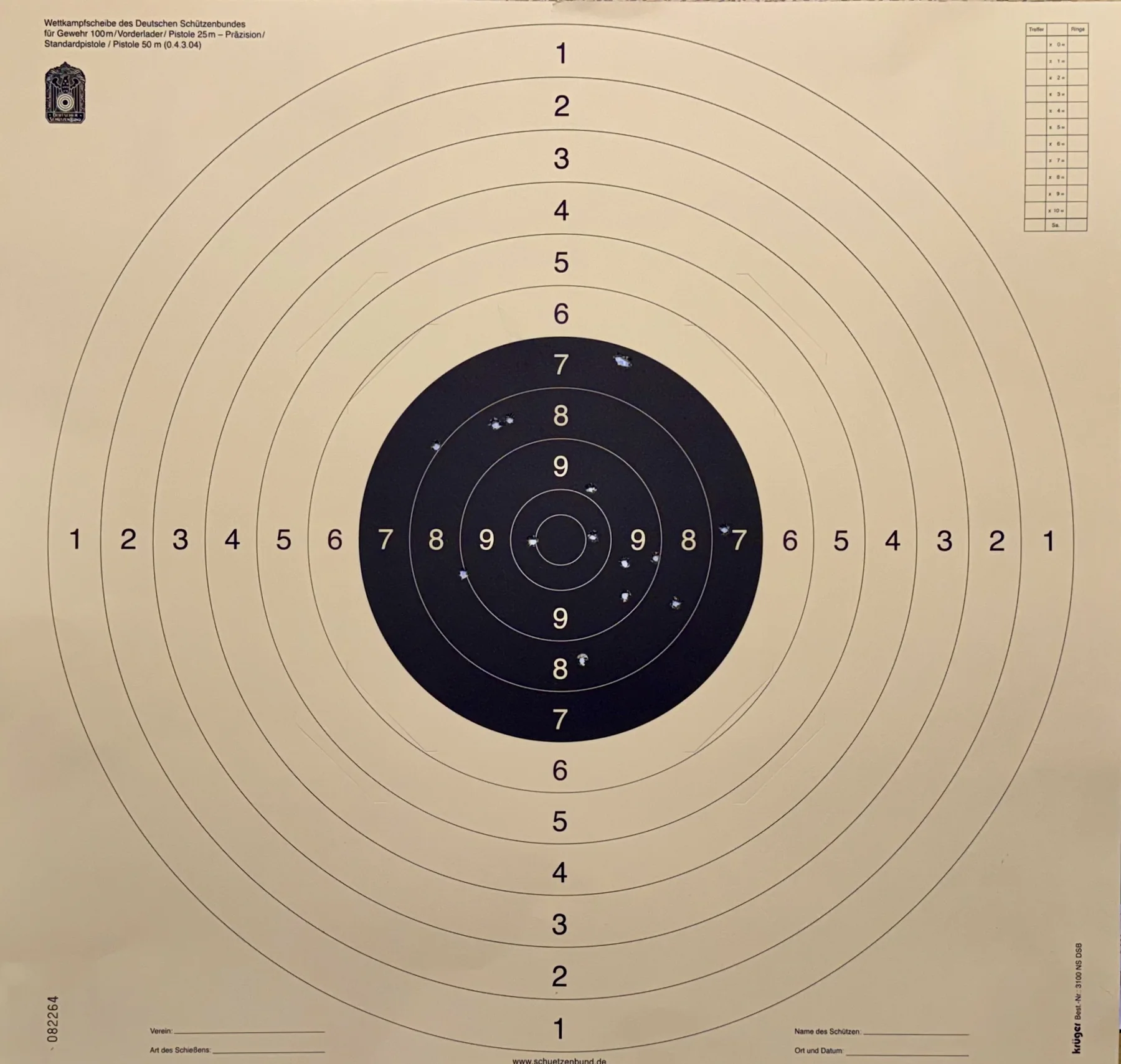 A square cream-coloured target sheet with a small black centre, concentric rings and rows of scoring numbers.