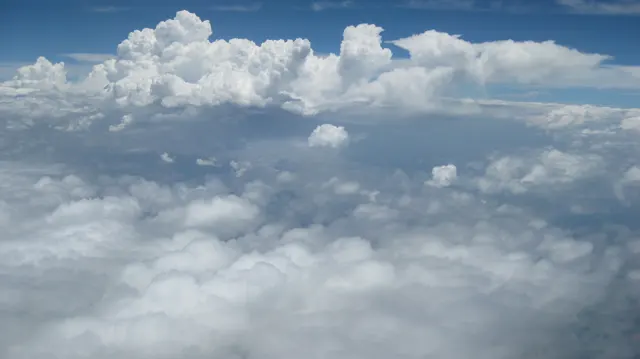 White cloud peaks rise above a softer lower blanket.
