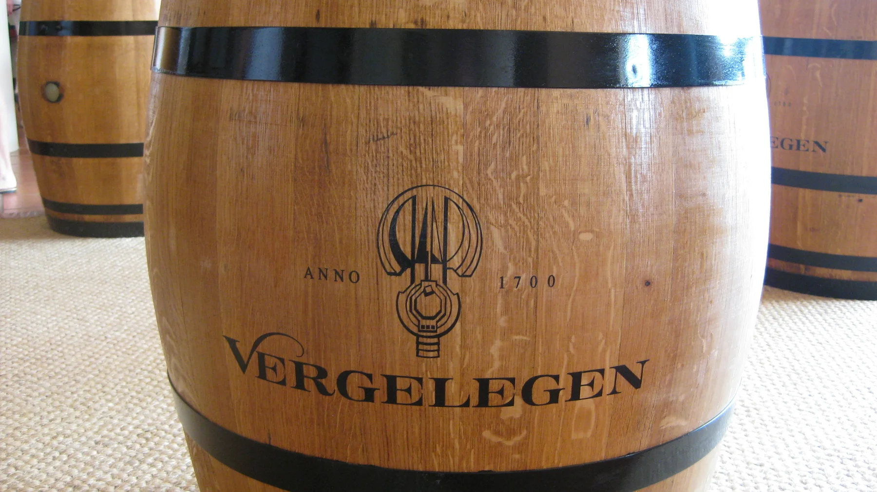A small wooden barrel bears the Vergelegen name.